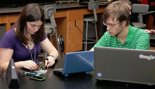 Two students working with Arduino in science class