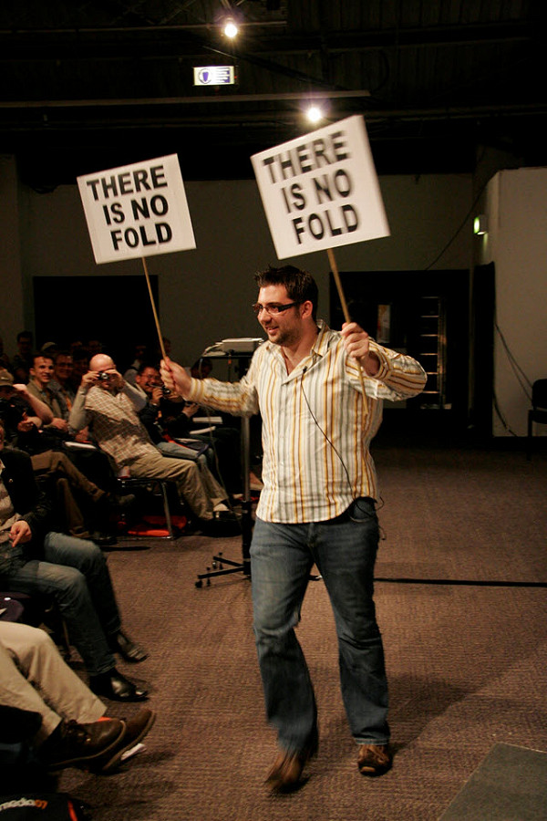 My husband holding up placards that say there is no fold